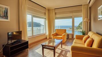 Junior Suite, Sea View | Living area | Flat-screen TV
