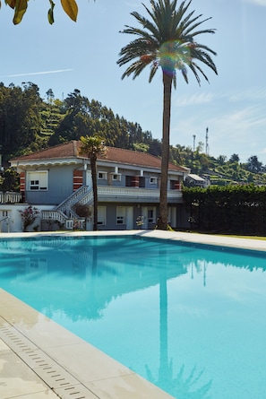 Seasonal outdoor pool, pool loungers