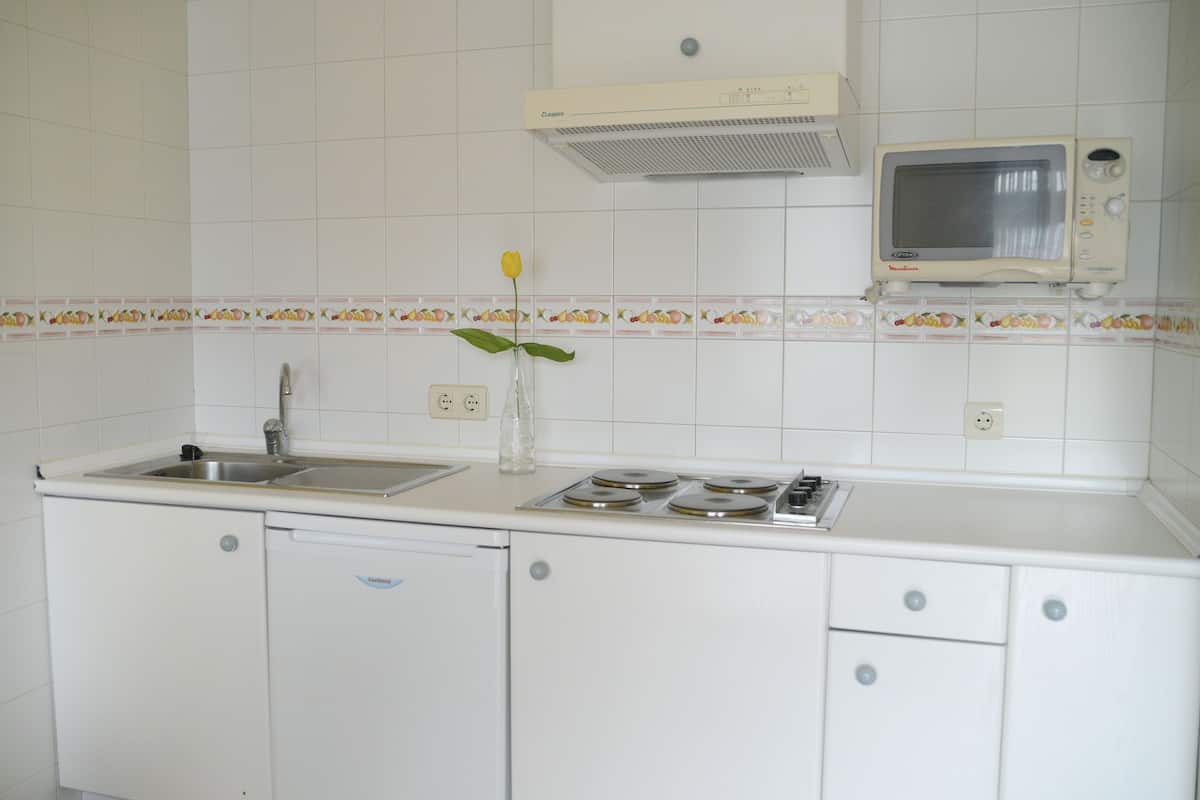 full-sized fridge, microwave, stovetop, espresso maker