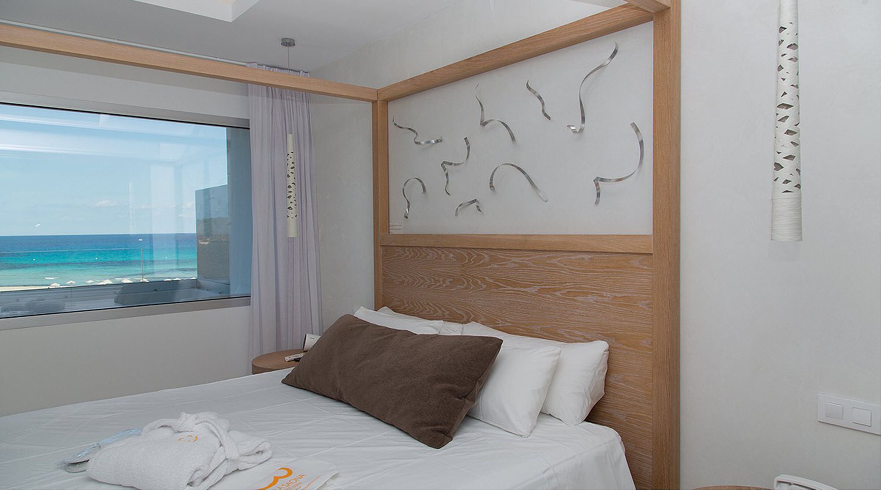junior suite, jetted tub, sea view | 1 bedroom, in-room safe, desk, blackout curtains
