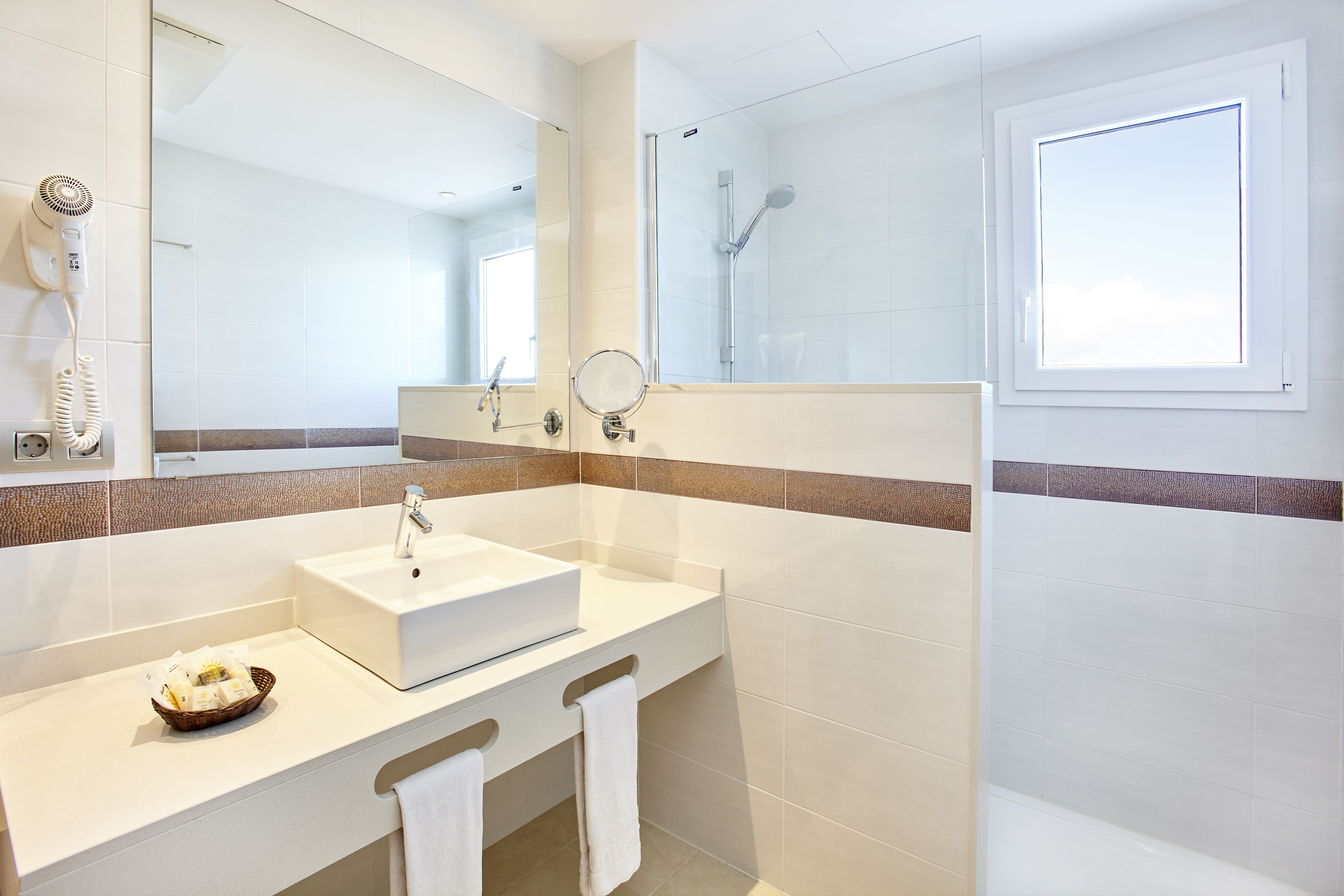 eco-friendly toiletries, hair dryer, towels