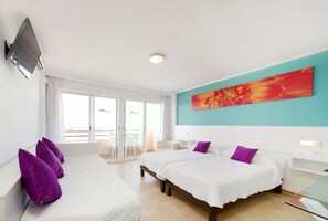 Triple Room | Minibar, individually decorated, individually furnished, desk