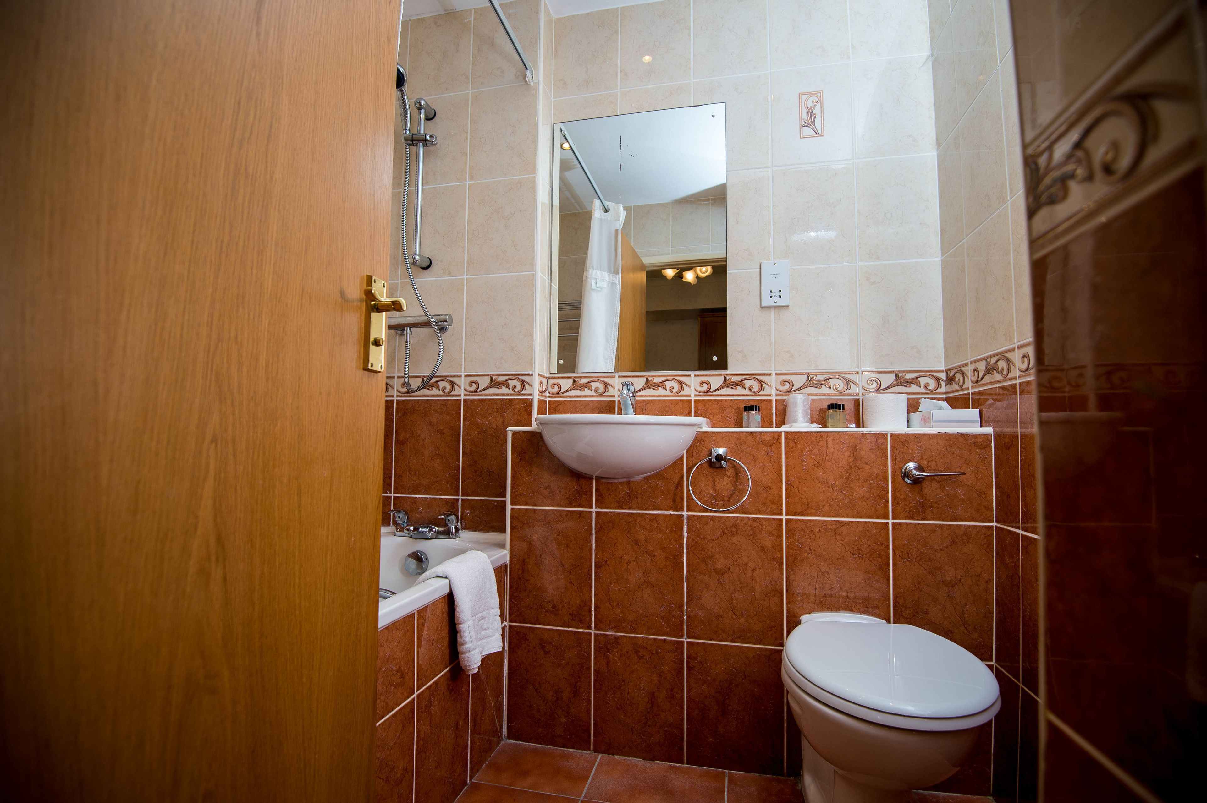 family quadruple room, multiple beds | bathroom | shower, hair dryer, bidet, towels