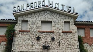 A stone building with the sign "SAN PEDRO HOTEL" at the top. - San Pedro Hotel (Rio Ceballos)