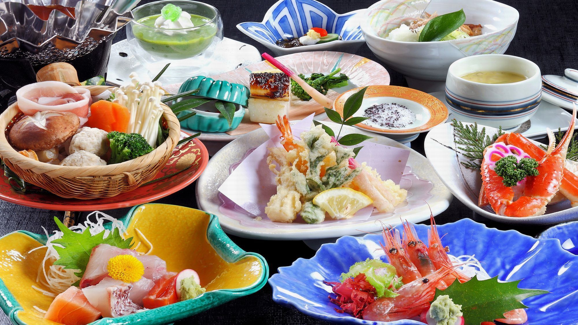 A variety of dishes including seafood, vegetables, and a sushi platter.