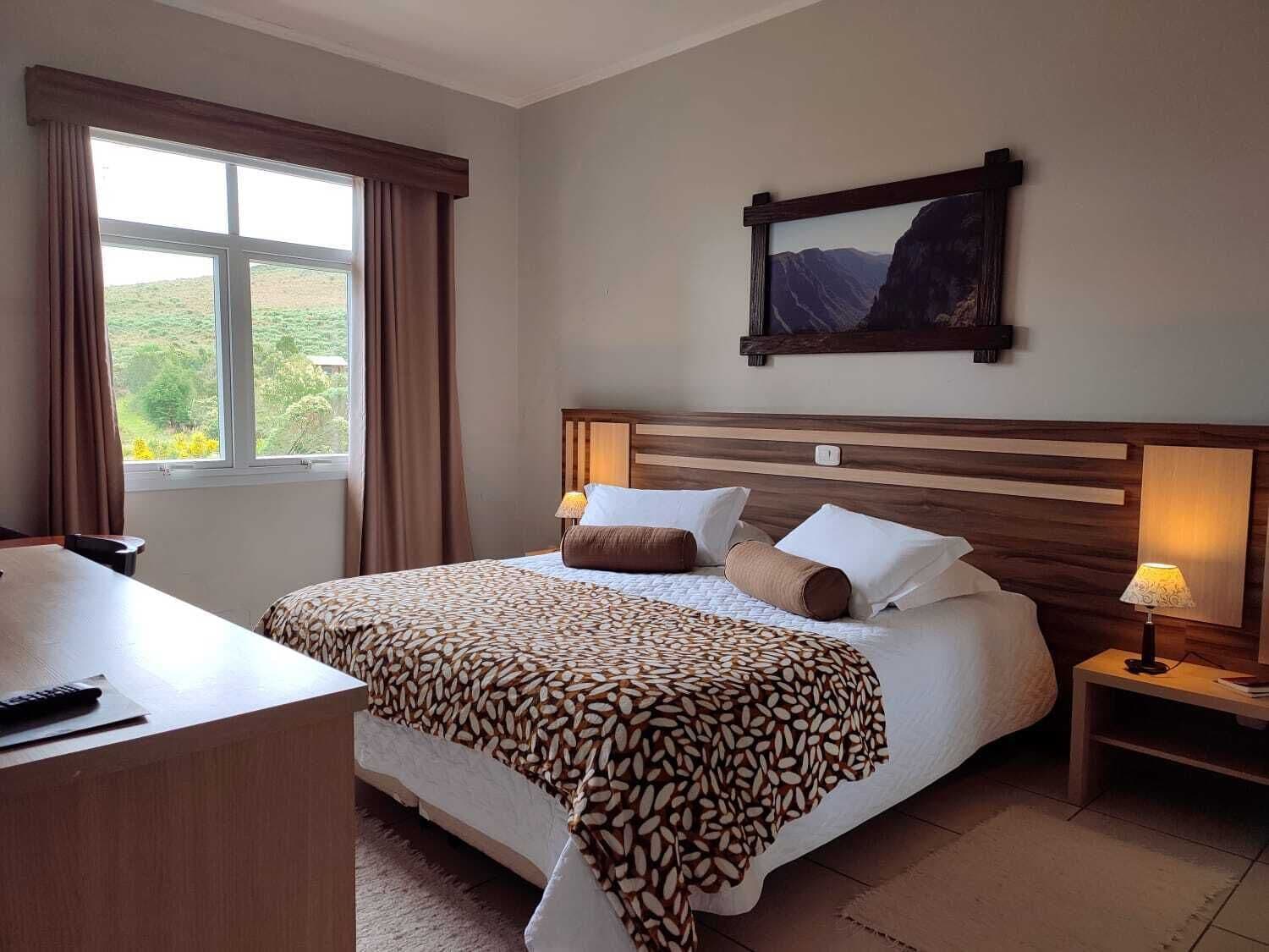 deluxe room | minibar, in-room safe, desk, blackout curtains