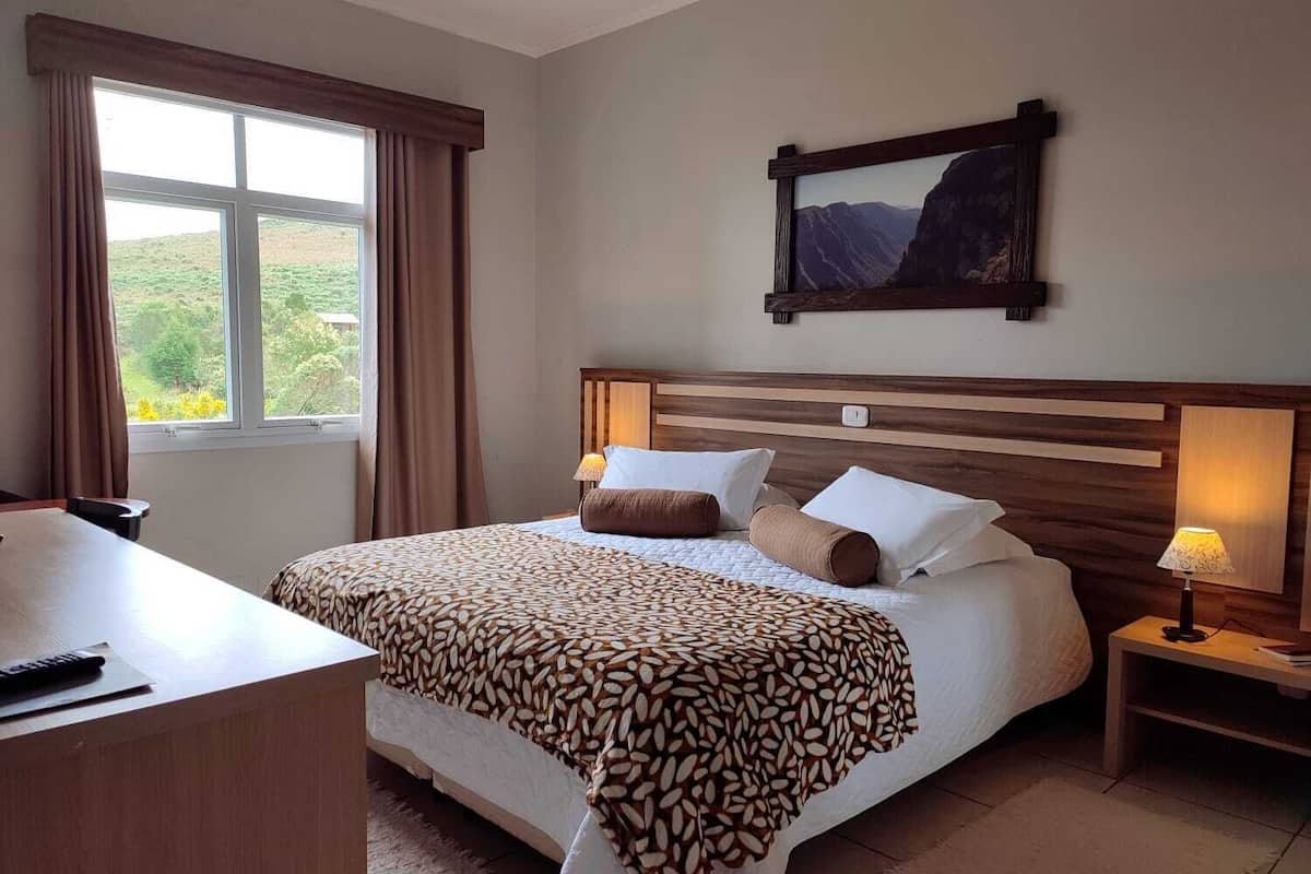 deluxe room | minibar, in-room safe, desk, blackout curtains