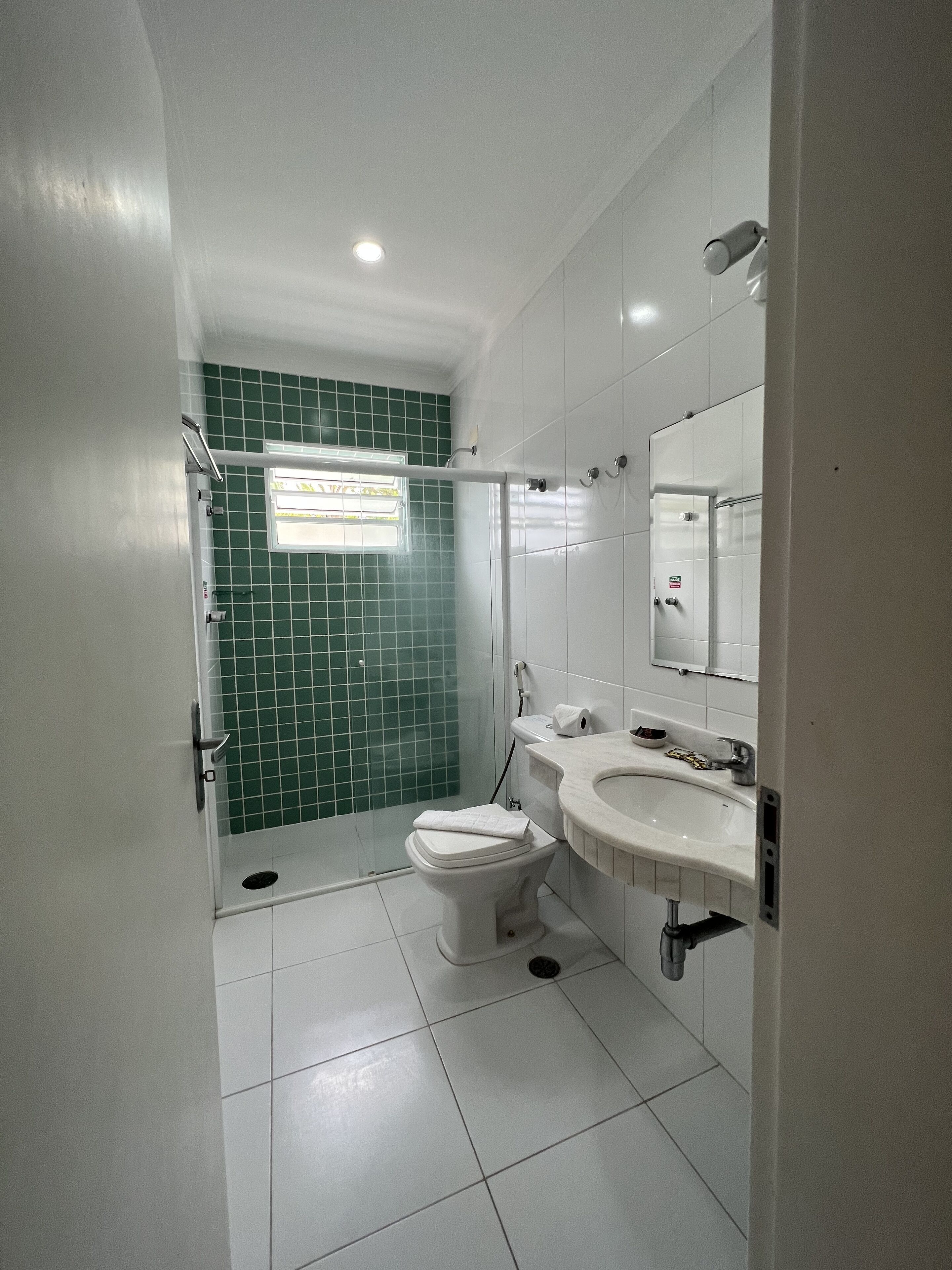 deluxe triple room | bathroom | shower, rainfall showerhead, hair dryer, towels