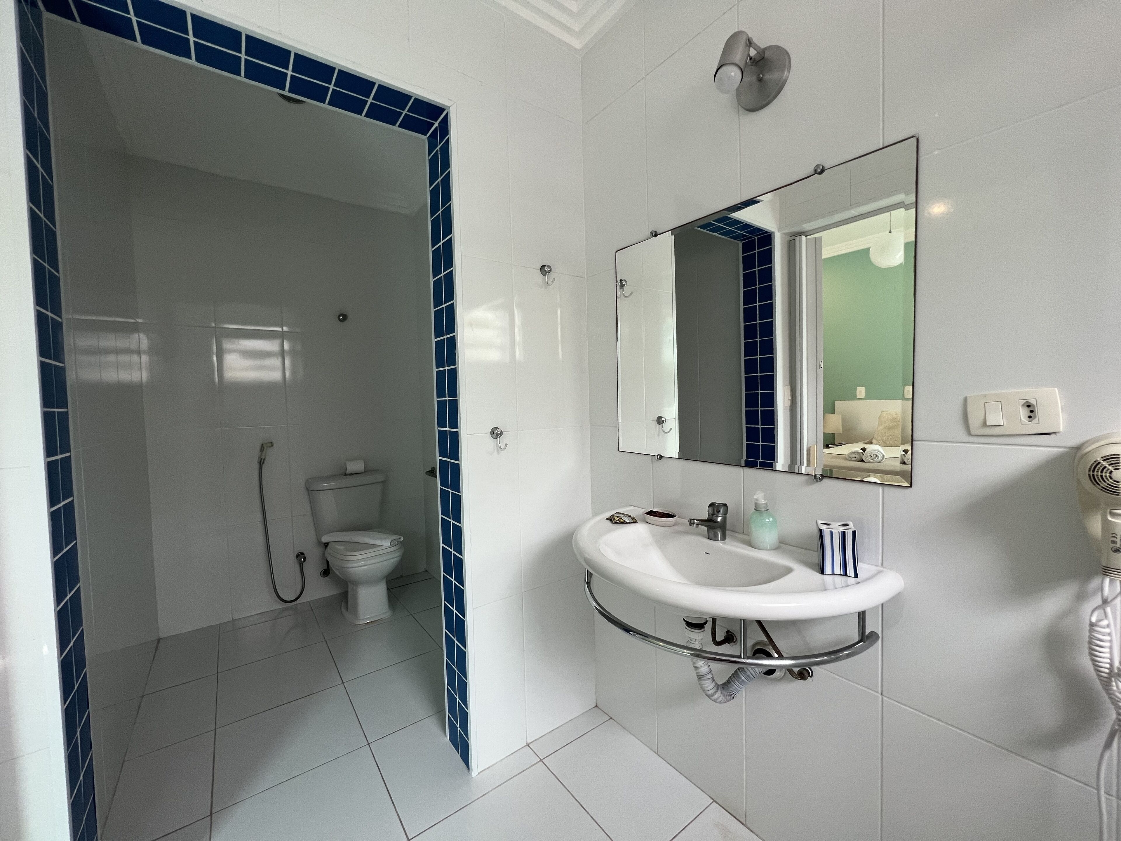 deluxe double room | bathroom | shower, rainfall showerhead, hair dryer, towels