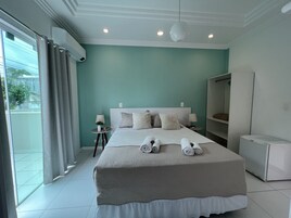 Deluxe Double Room | Minibar, individually decorated, individually furnished, blackout drapes