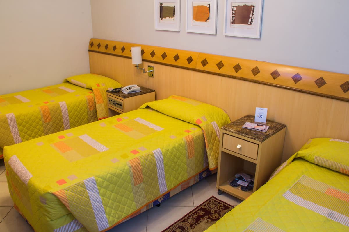 Standard Triple Room, 3 Single Beds | Minibar, in-room safe, desk, blackout curtains