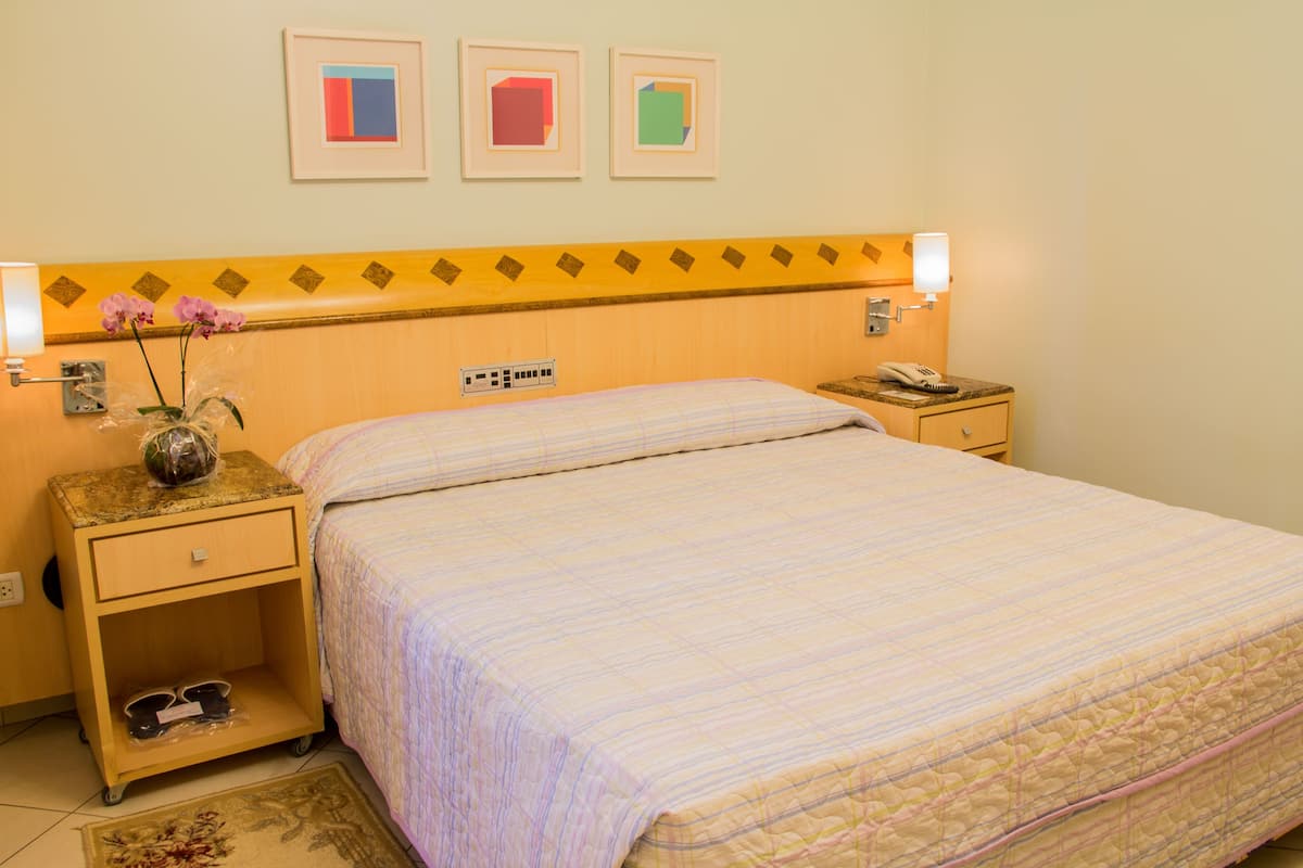 Standard Double Room | Minibar, in-room safe, desk, blackout curtains