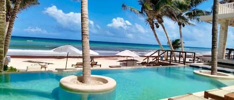 Private beach, white sand, free beach cabanas, sun loungers
