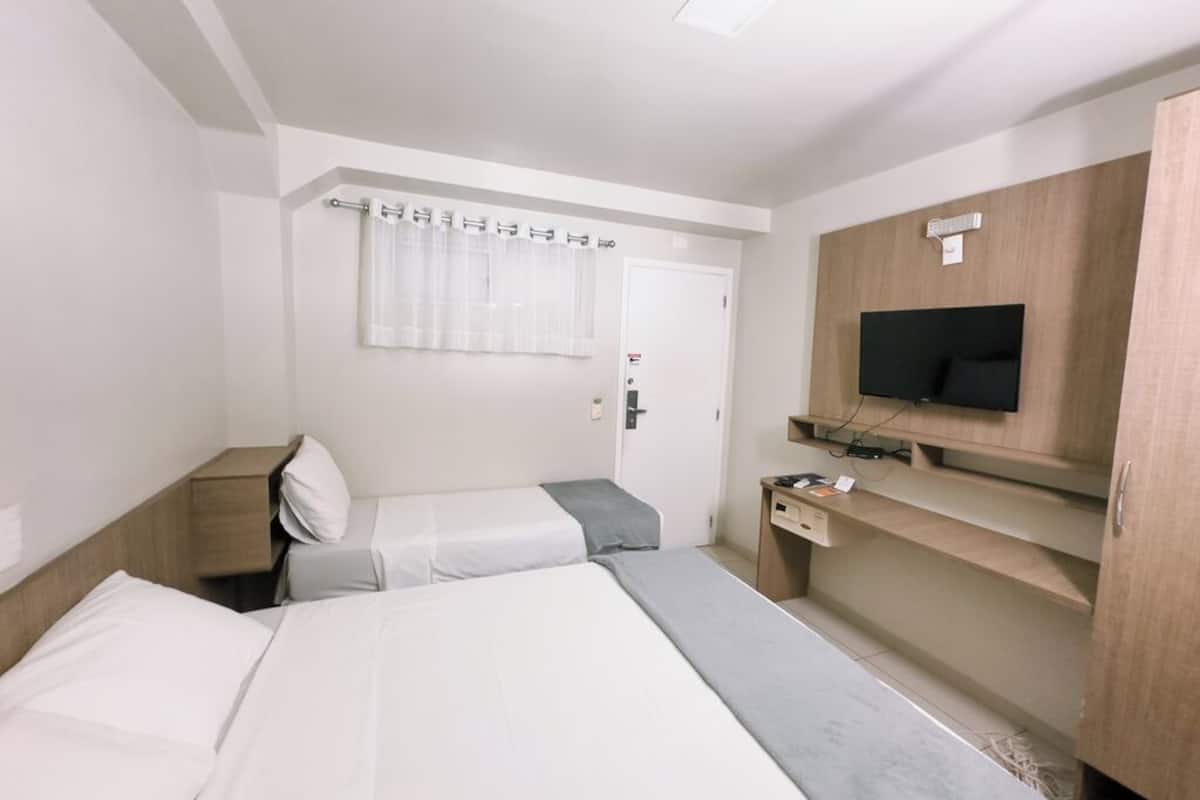 standard triple room, multiple beds | in-room safe, desk, blackout curtains, free wifi