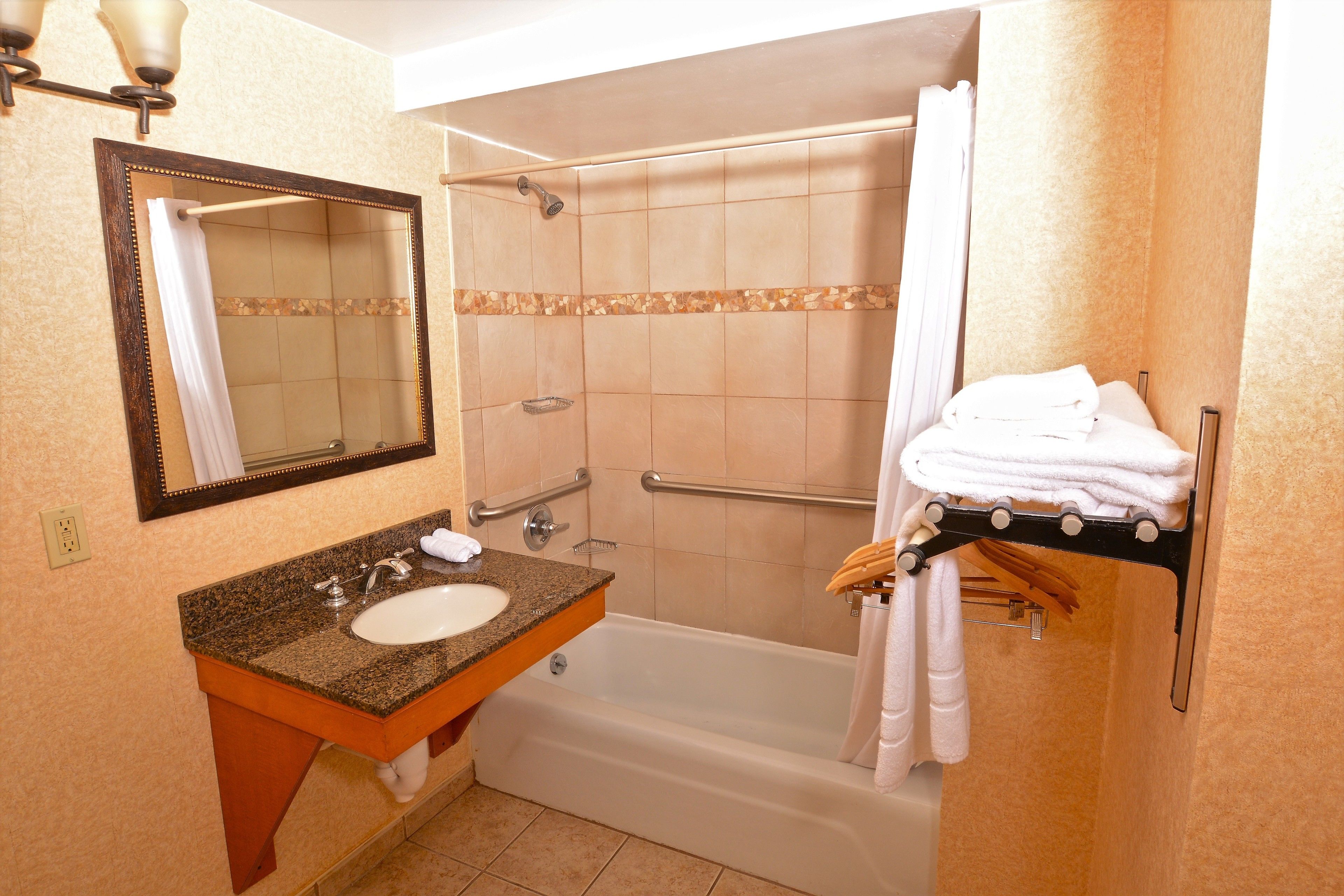 combined shower/bathtub, designer toiletries, hair dryer, towels