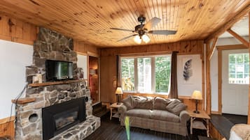 Cottage, 3 Bedrooms, Accessible, Partial Lake View | Living area | Flat-screen TV, fireplace