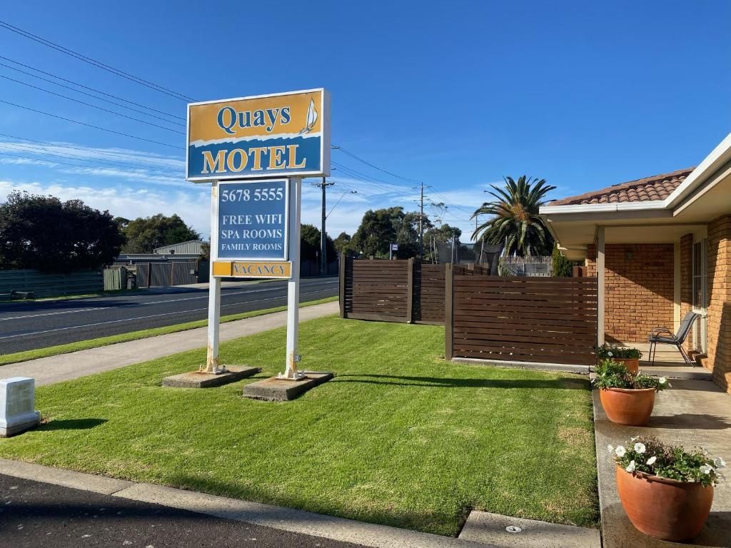 A motel sign with contact information and amenities listed.