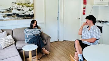 Two Bedroom Family Cabin | Living area | Flat-screen TV, table tennis