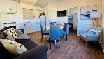 Two Bedroom Luxury Cabin | Living area | Flat-screen TV, ping pong