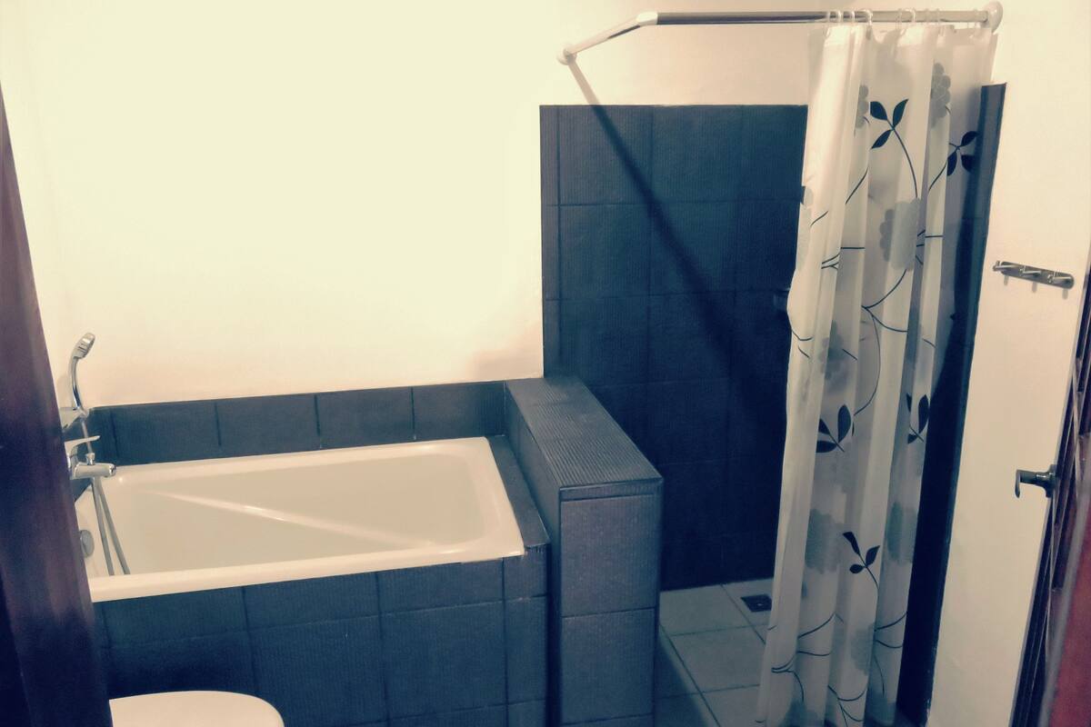 family room, 1 bedroom, garden view | bathroom | shower, free toiletries, hair dryer, towels