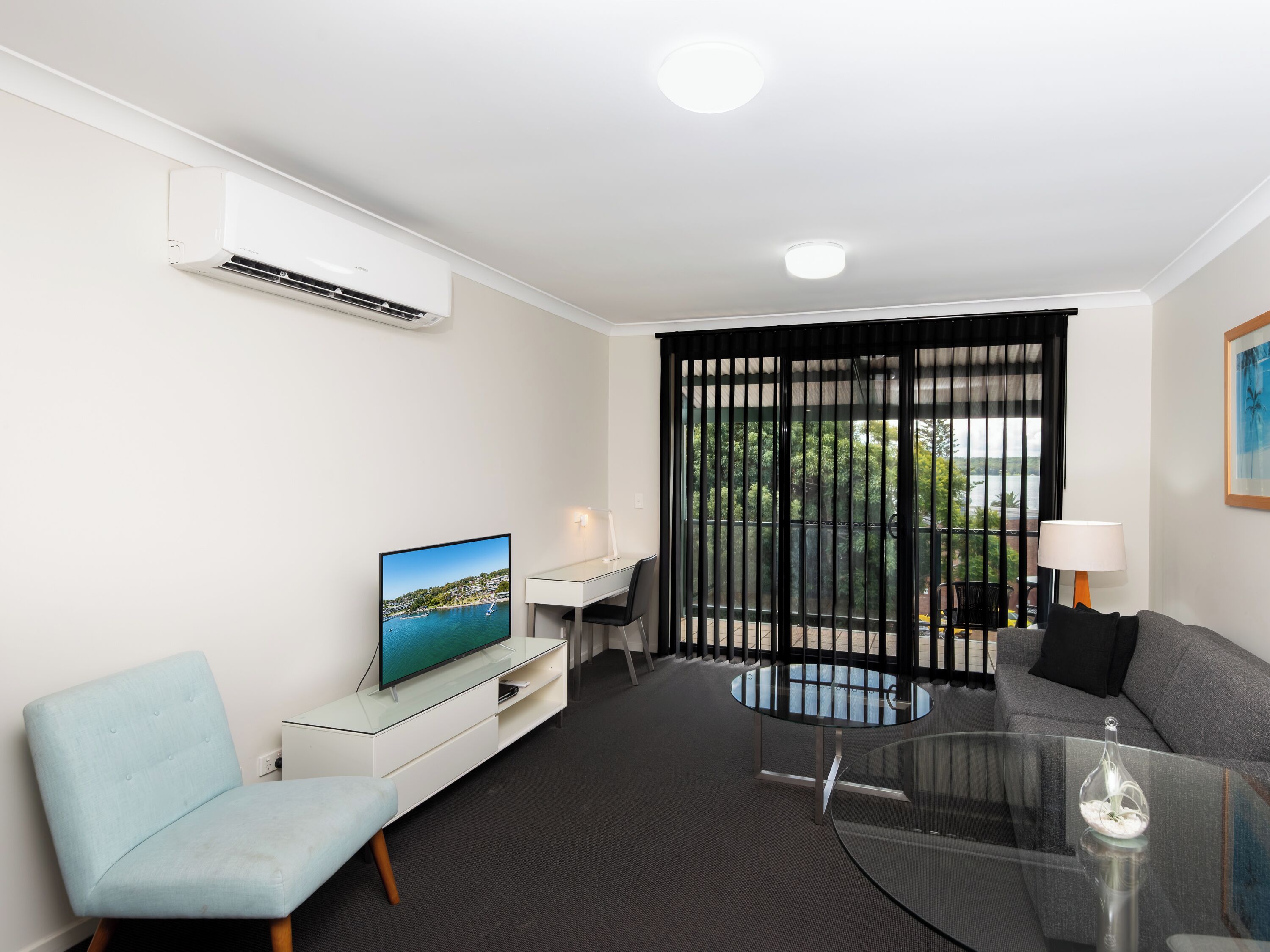 one bedroom lakeview apartment | living area | flat-screen tv