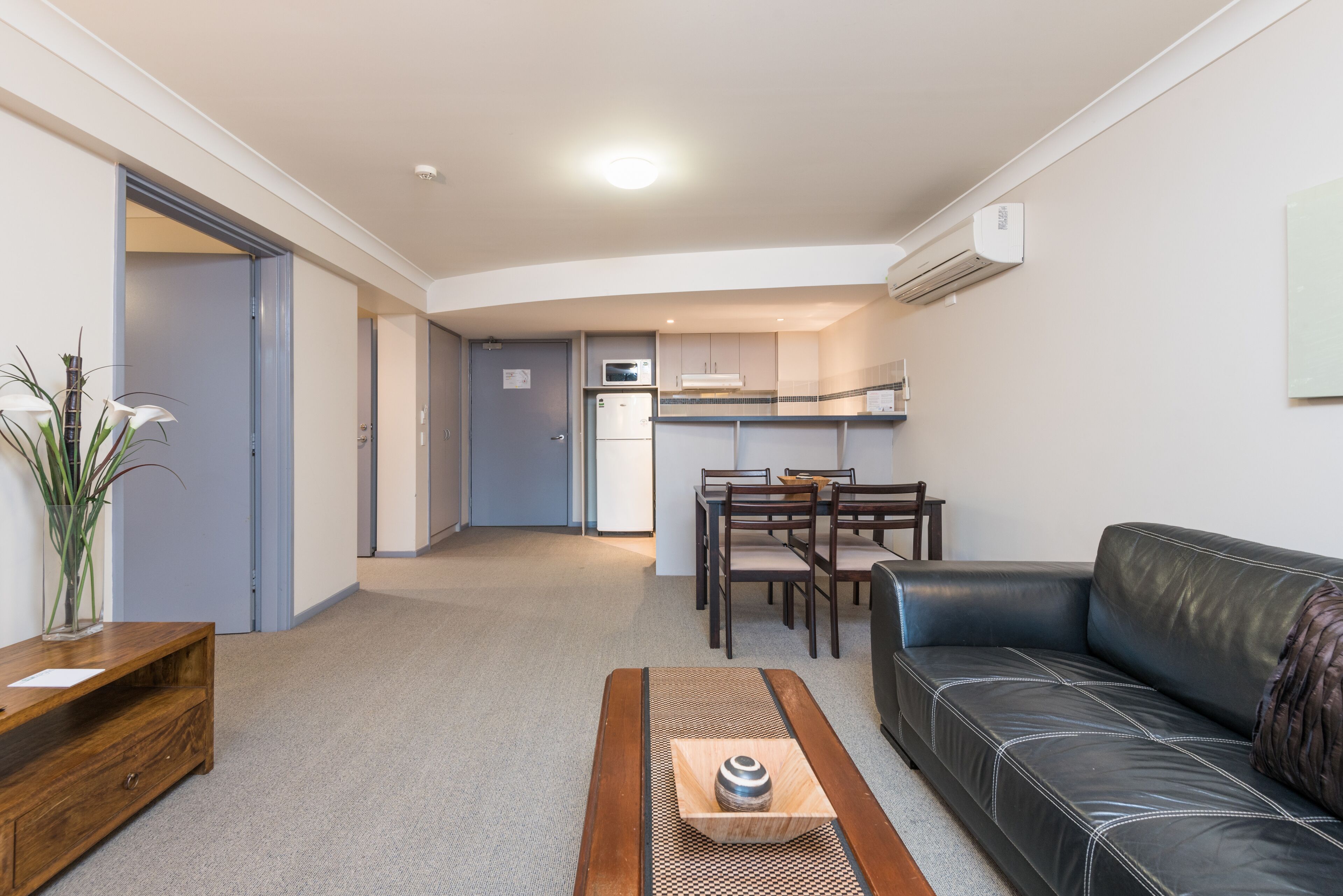 one bedroom accessible apartment | living area | flat-screen tv