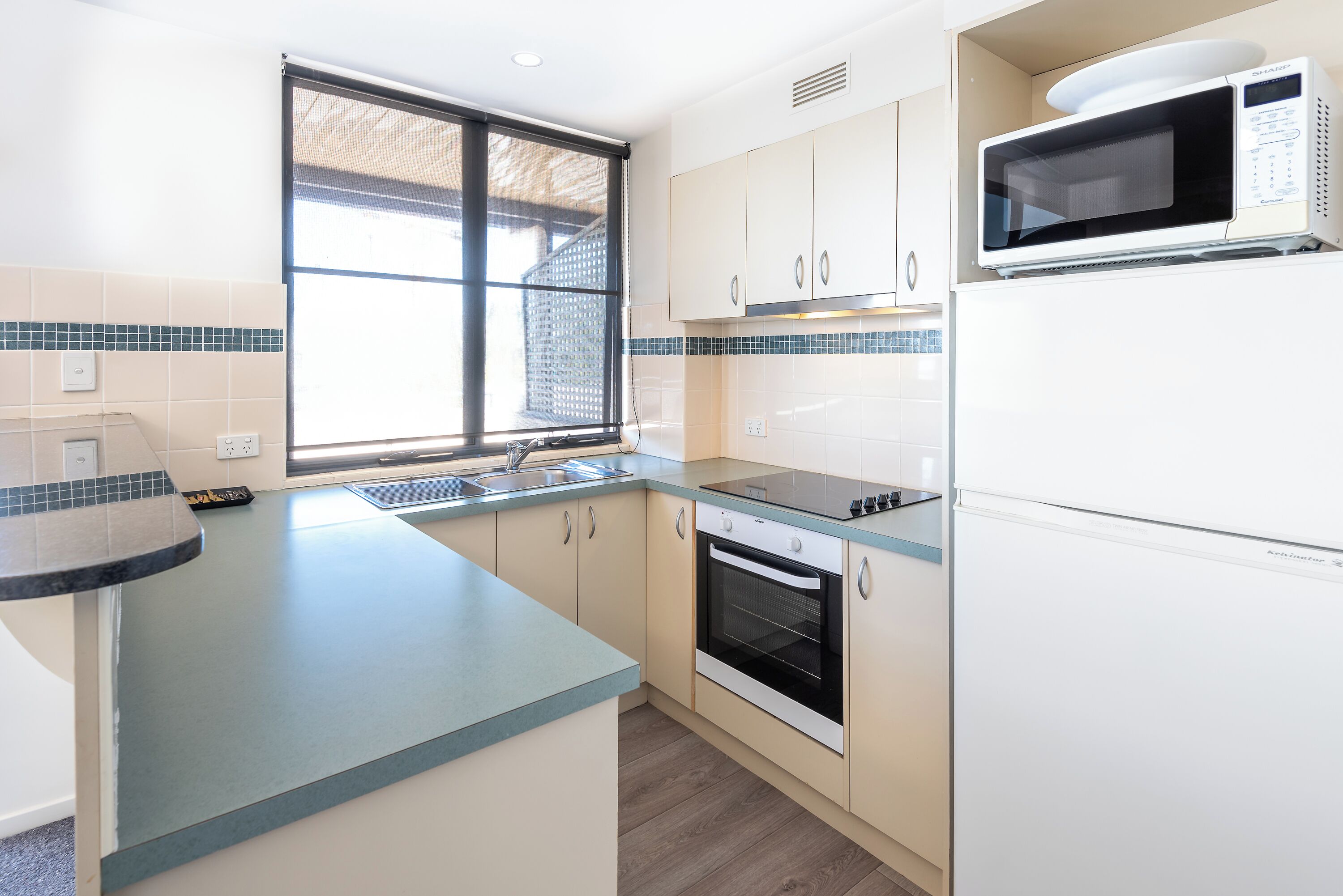 premium lakeview apartment | private kitchen | fridge, coffee/tea maker