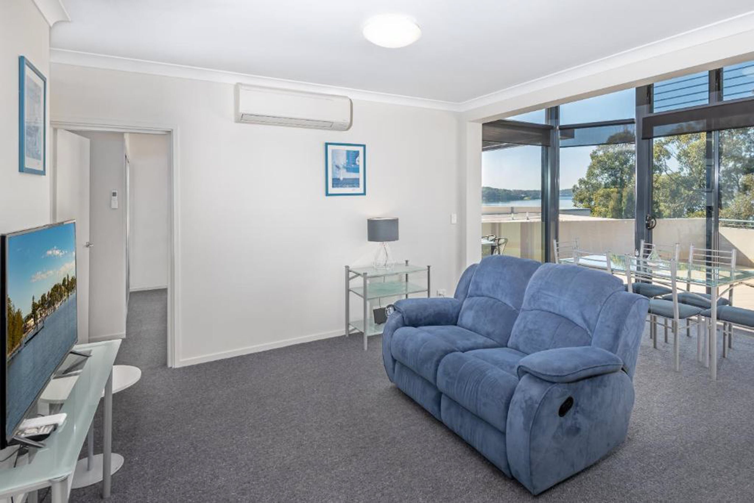 premium lakeview apartment | living area | flat-screen tv