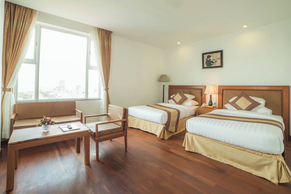 In-room safe, desk, laptop workspace, bed sheets