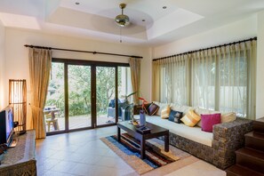 Family Villa, 2 Bedrooms, Kitchen, Garden Area | Living area | 30-inch LCD TV with satellite channels, TV, DVD player