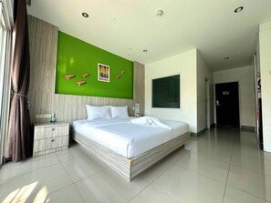Deluxe Room, Pool Access | Minibar, in-room safe, desk, free WiFi