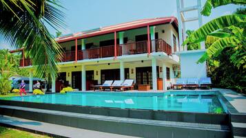 Outdoor pool, pool umbrellas, pool loungers