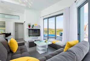 Villa, 4 Bedrooms, Private Pool (Chara) | Living room | Flat-screen TV, table tennis