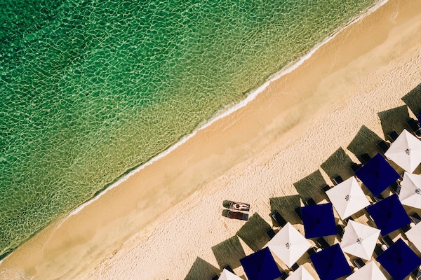 On the beach, sun loungers, beach umbrellas, beach towels