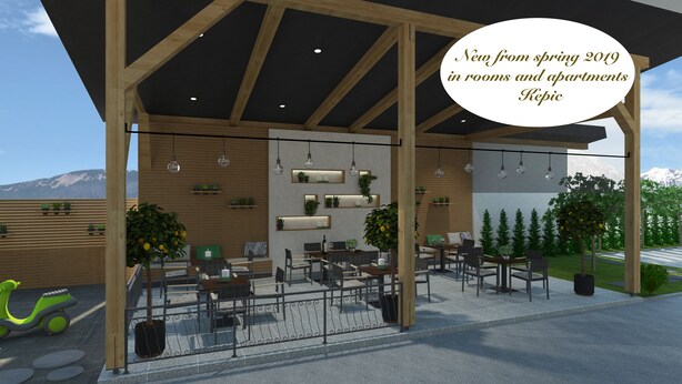 A modern outdoor seating area with wooden beams, potted plants, and a view of mountains. - Rooms & Apartments Kepic (Cerklje na Gorenjskem)