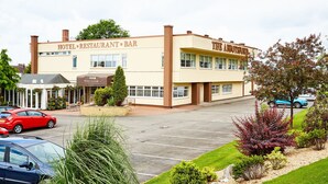 A two-story building with a sign reading "HOTEL RESTAURANT BAR" and "THE ARDMORE HOTEL." - Abbotsford Hotel (Dumbarton)