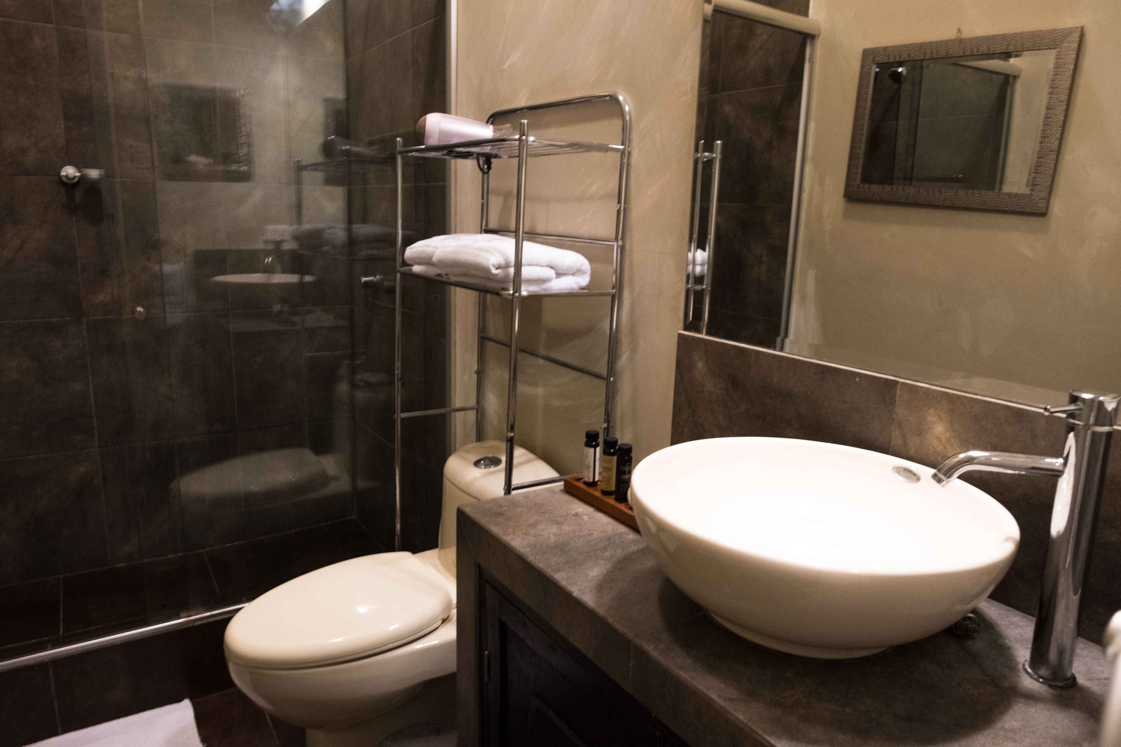 designer toiletries, hair dryer, bathrobes, towels