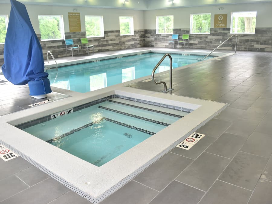 Indoor pool, open 7 AM to 11 PM, pool loungers
