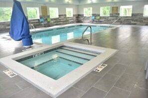 Indoor pool, open 7 AM to 11 PM, pool loungers