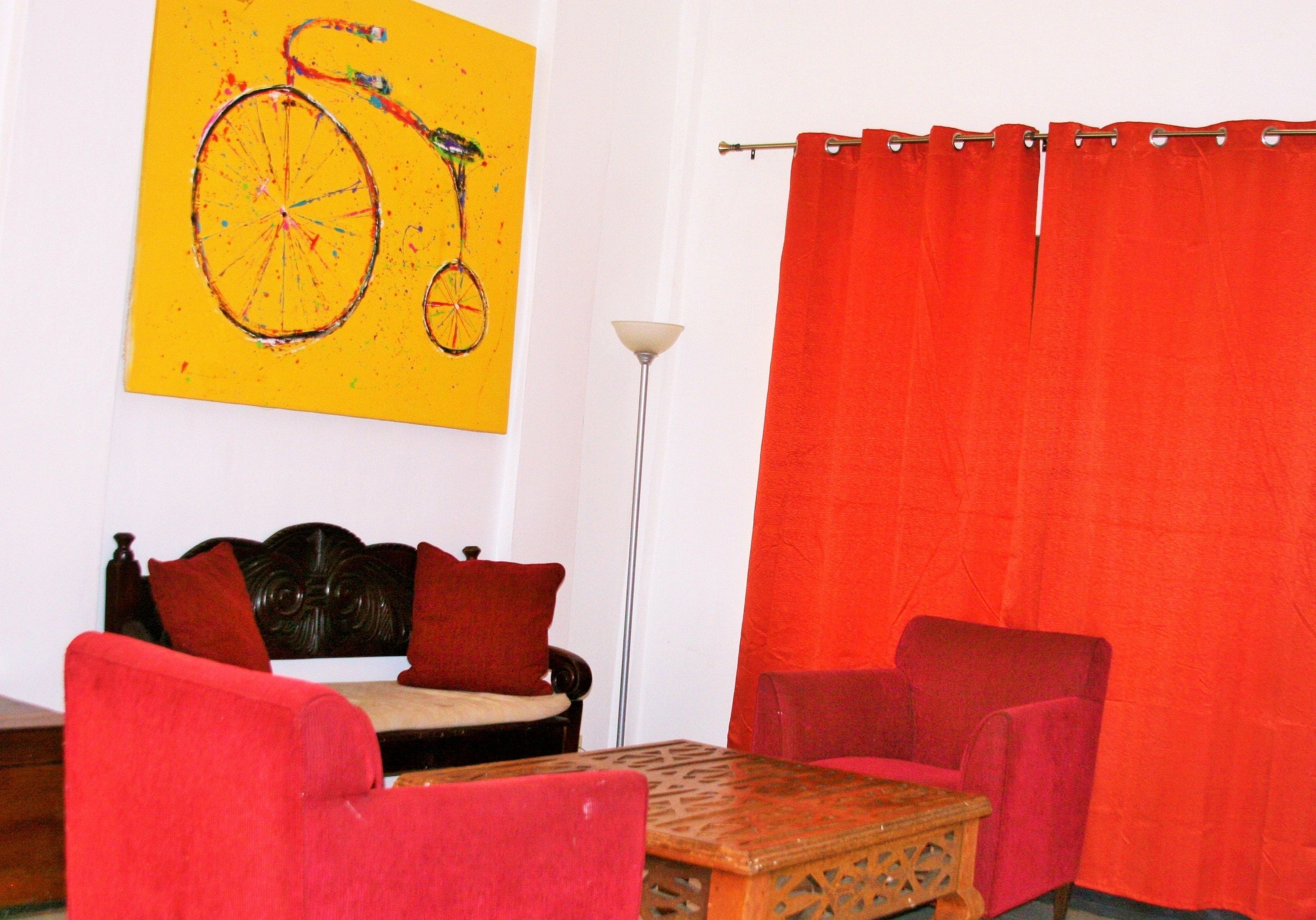 business apartment, 1 queen bed | living area | 32-inch lcd tv with cable channels, plasma tv