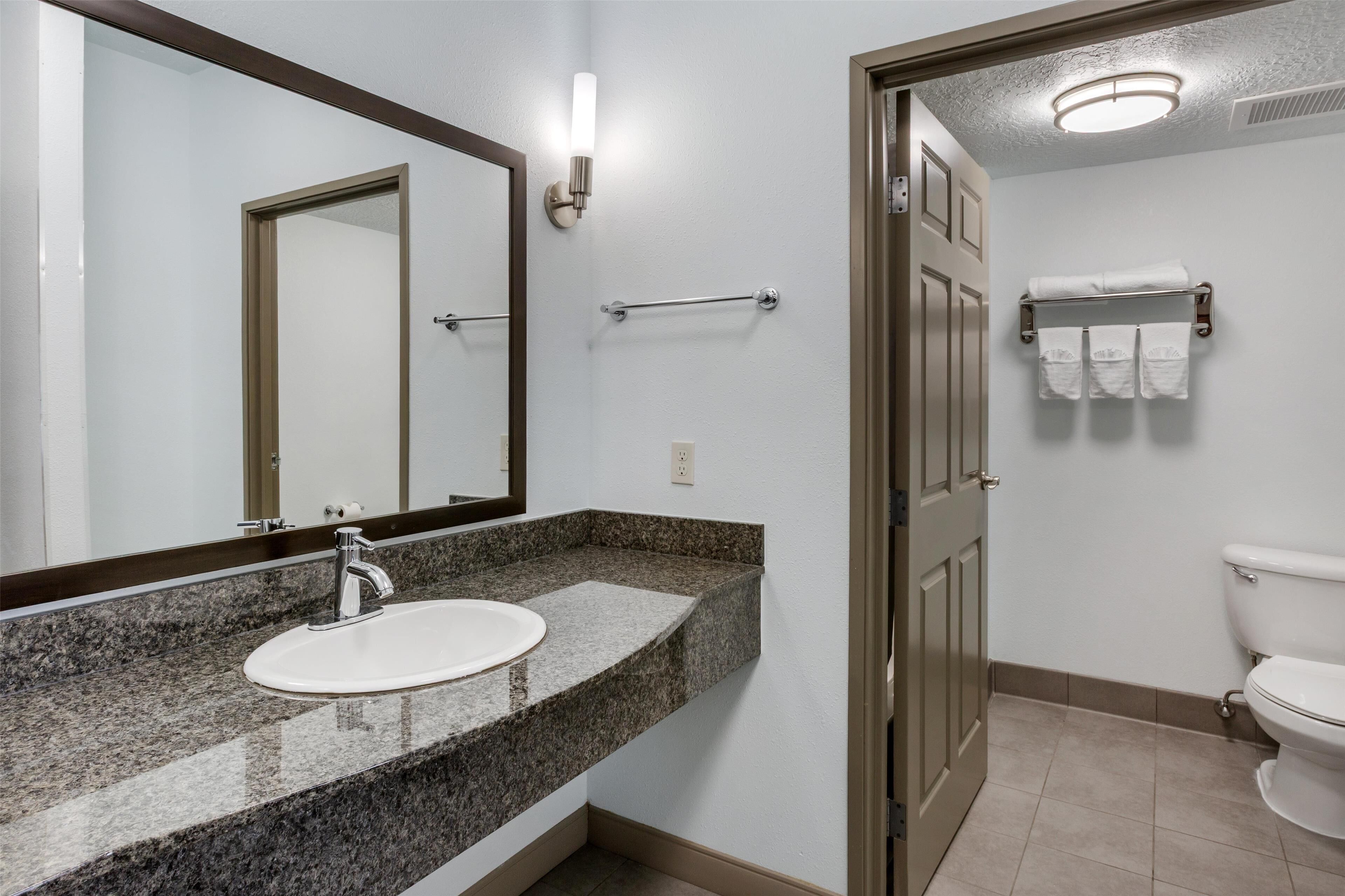 suite, 1 king bed, non smoking | bathroom | combined shower/bathtub, hair dryer, towels