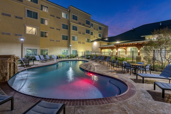 Outdoor pool, open 10:00 AM to 10:00 PM, pool loungers