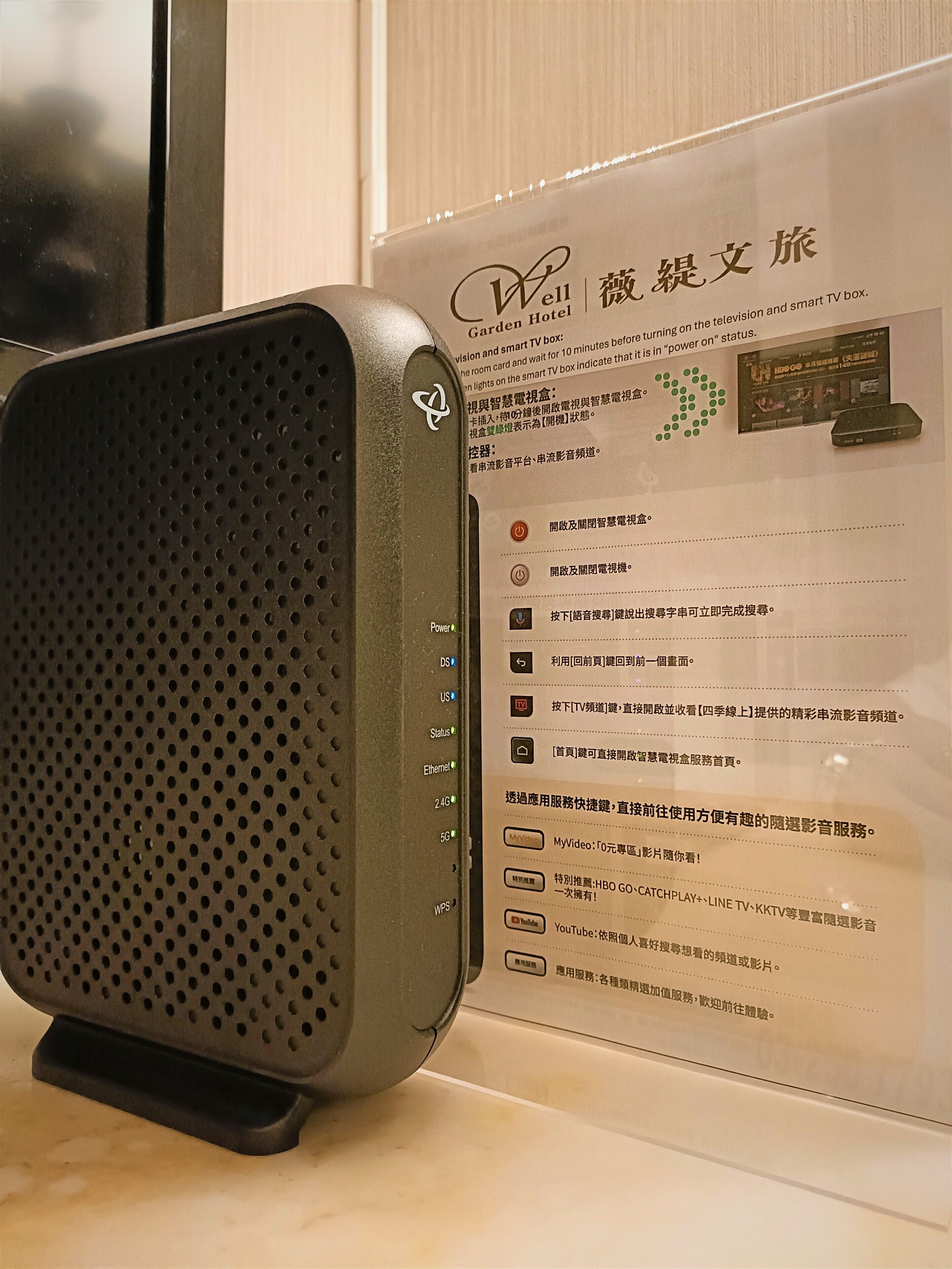 A portable speaker with a perforated front panel and a control panel with various buttons and indicators.