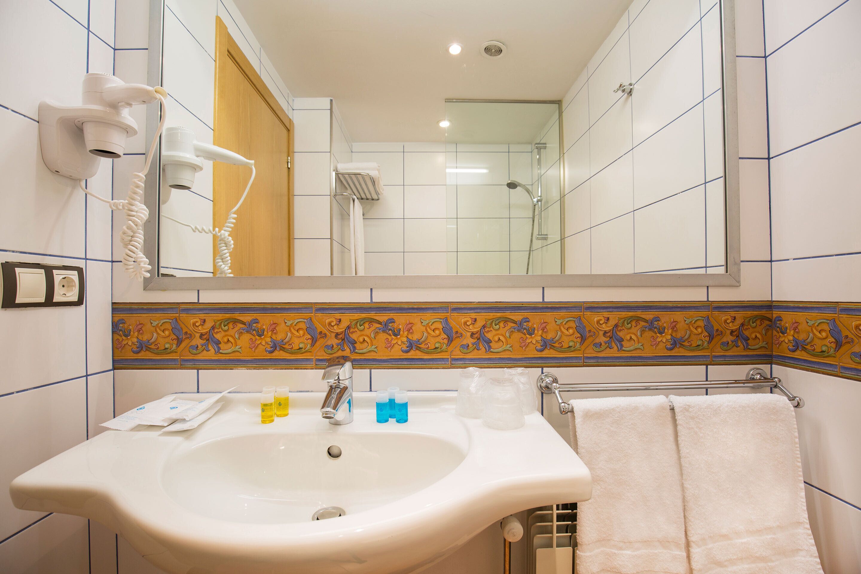 deep-soaking bathtub, hair dryer, towels, soap