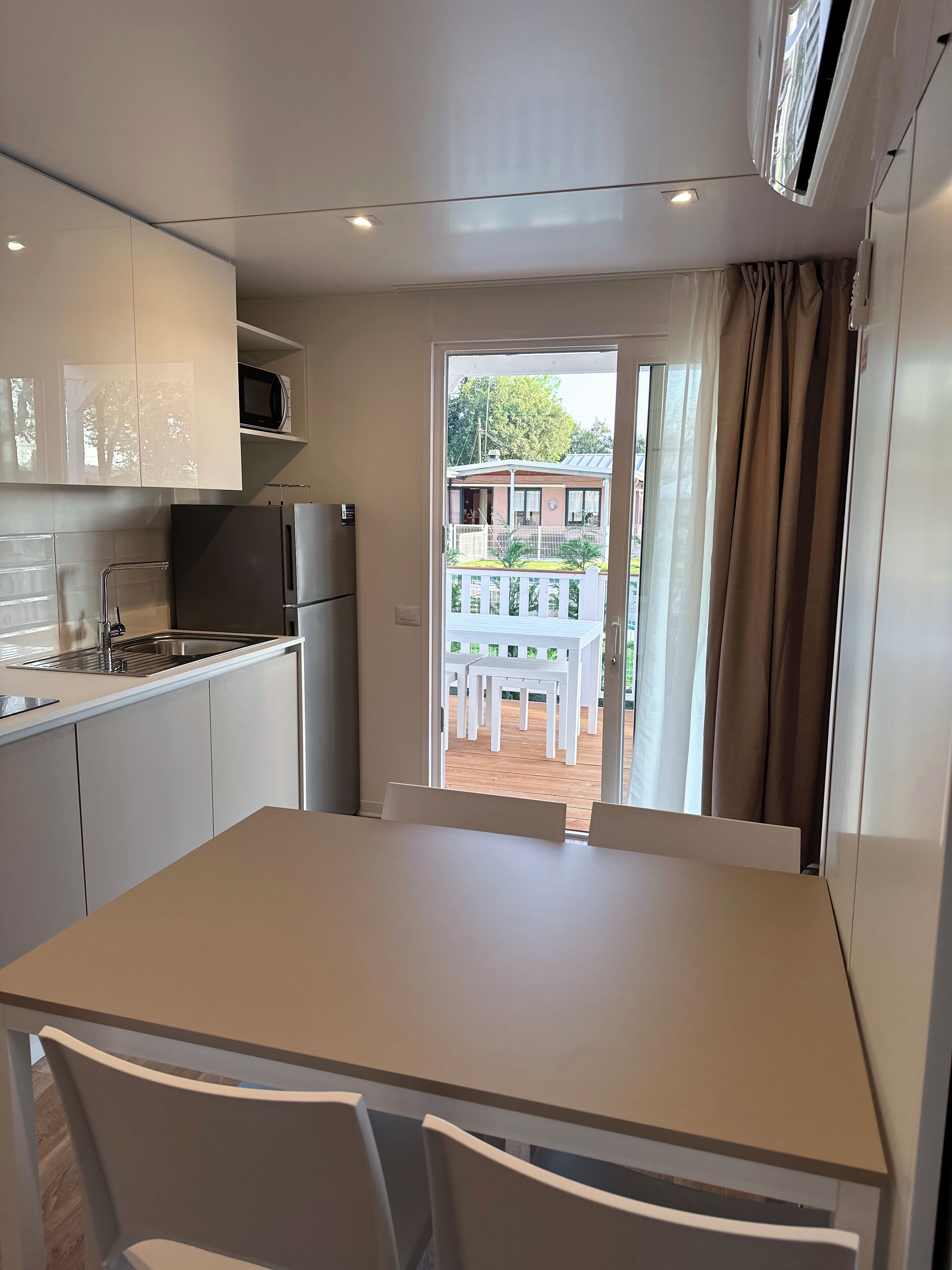 Comfort Mobile Home, Kitchen, Pool View | Private kitchen | Full-size fridge, microwave, stovetop, highchair