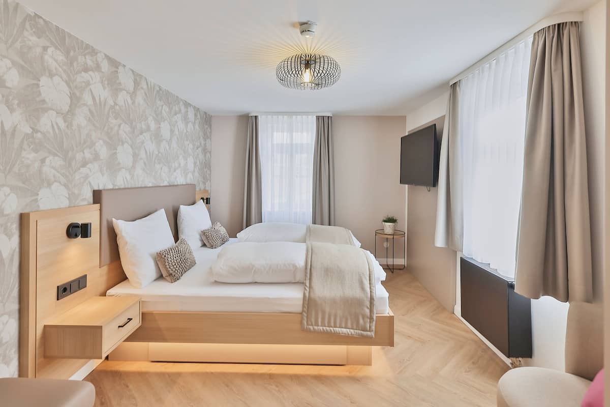 deluxe double room, 1 king bed, refrigerator | 1 bedroom, premium bedding, desk, blackout curtains