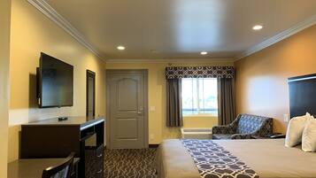 Habitación Deluxe, 1 cama King size | Cortinas blackout, tabla de planchar con plancha y wifi gratis