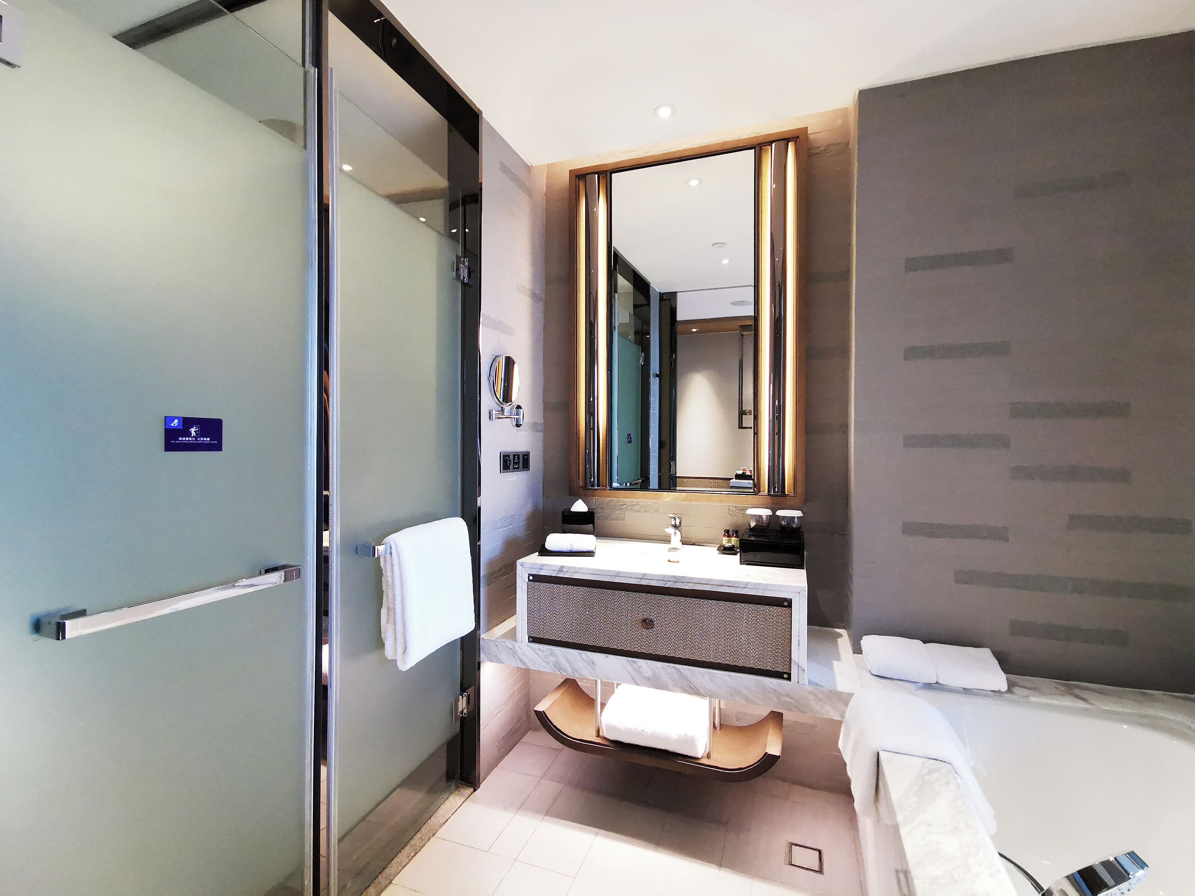 deluxe twin room   | bathroom | separate bathtub and shower, rainfall showerhead, designer toiletries