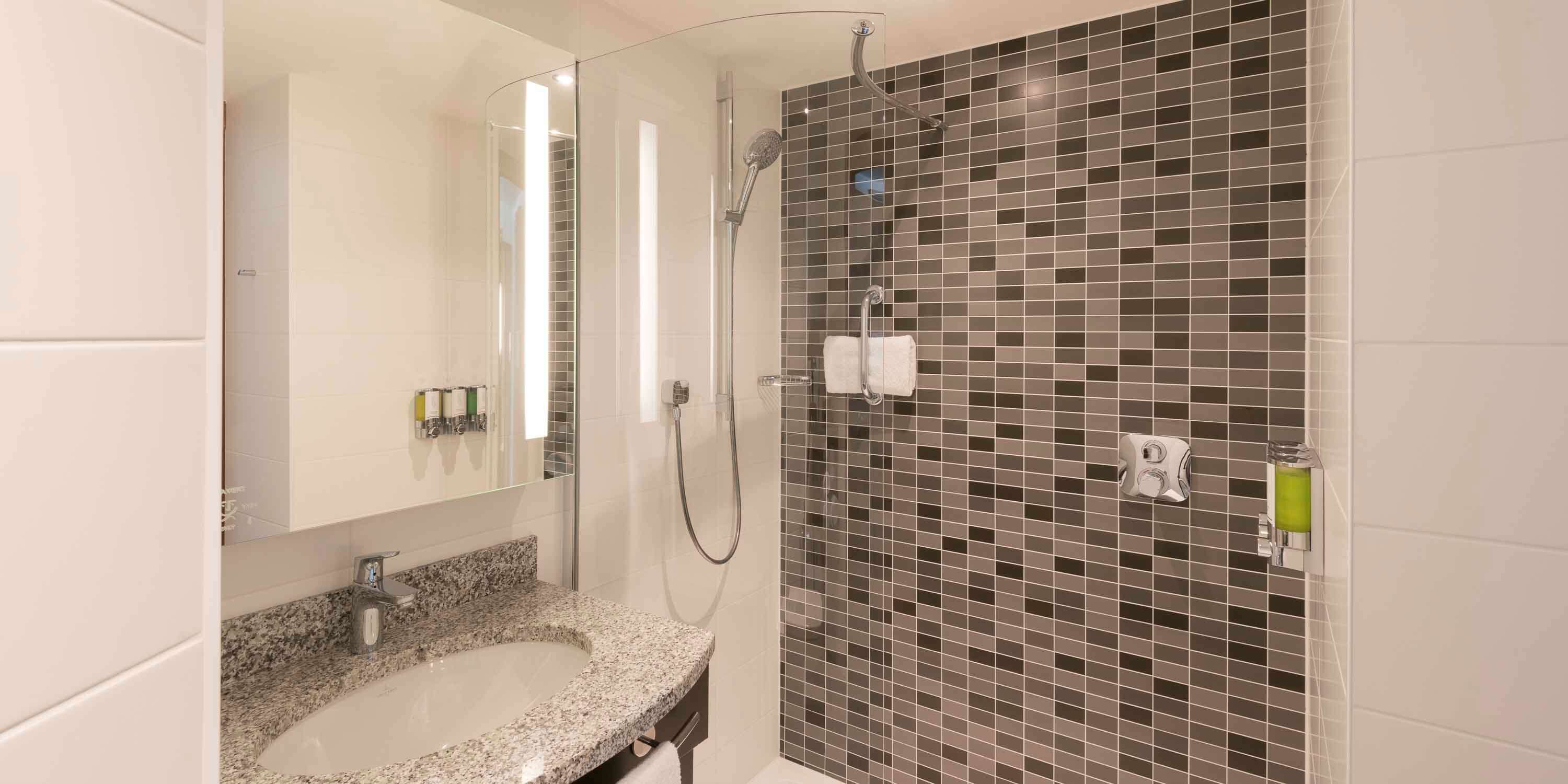 combined shower/bathtub, free toiletries, hair dryer, bathrobes