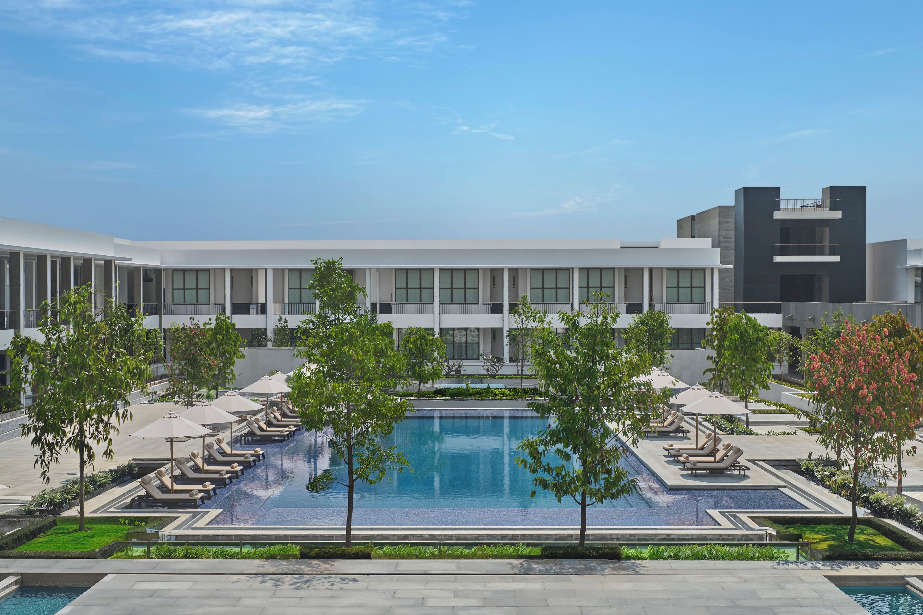 Outdoor pool, open 7:00 AM to 7:00 PM, pool umbrellas, sun loungers